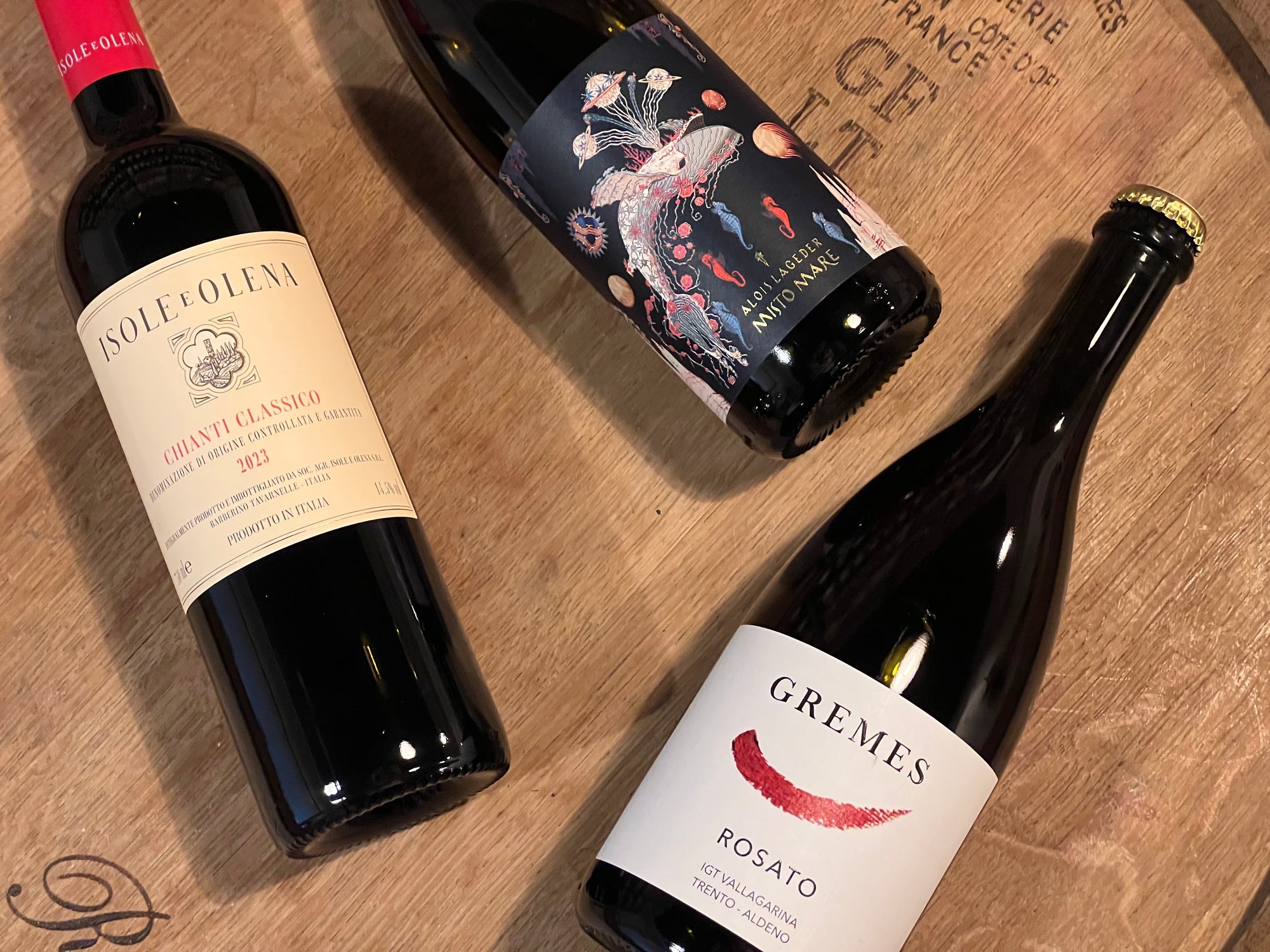 Bottiglie isole e olena chianti classico, gremes rosato e alois lageder misto mare